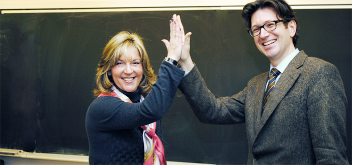 Rosalie Jukier and Robert Leckey high-five each other