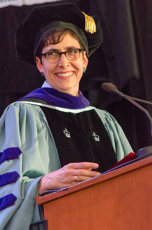 Prof. Shauna Van Praagh in academic robes introducing the winner of the Durnford Award at the Spring 2016 Convocation ceremony.