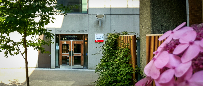 The words 'Audi Alteram Partem' or 'Hear the other side' are emblazoned above the west door of Chancellor Day Hall