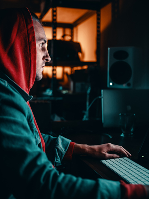 Cyber criminal at work. Image by Avi Richards via Unsplash.com