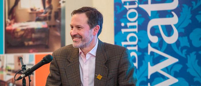 James Hughes speaking at the “Beyond Shelters: Solutions to Homelessness in Canada from the Front Lines” book launch, a book that he edited in 2018. Photo from the Old Brewery Mission site.